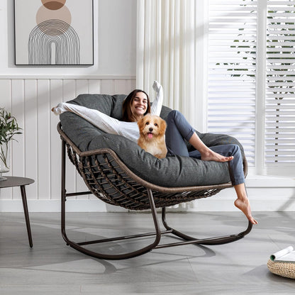 Your Personal Sanctuary: A Plush Rocking Papasan for Quiet Afternoons and Turning Pages.